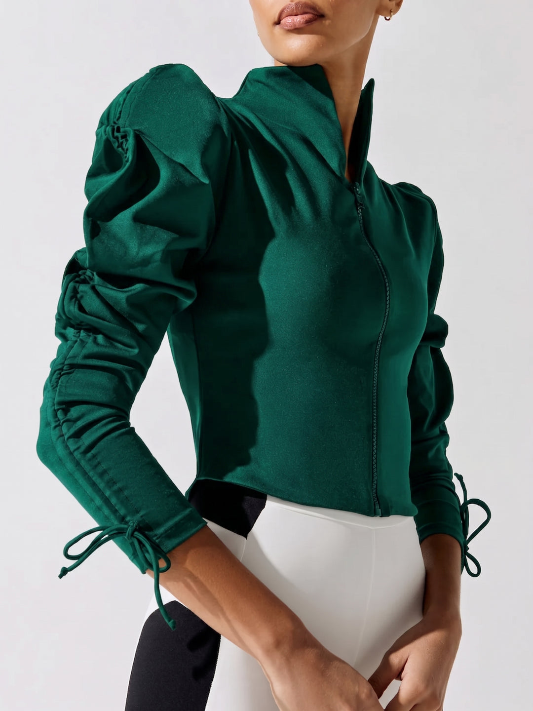Green jacket with puff sleeves on a white background